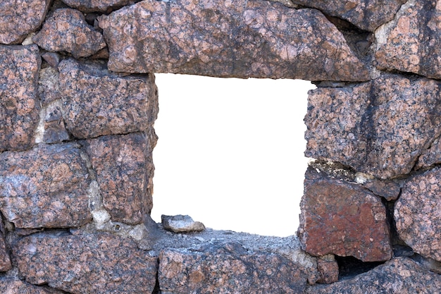 Rechthoekig gat in de muur gemaakt van natuursteen. Hoge kwaliteit foto