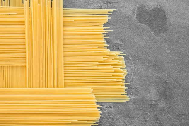 Rechthoekig geometrisch patroon van pasta bavette Achtergrondafbeelding van pasta van durumtarwe