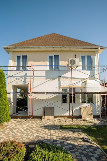 reconstruction of the house Insulation of the house with polystyrene foam plastering applying plaste