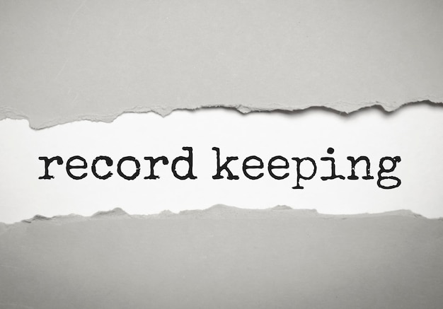 Photo record keeping text on white torn paper