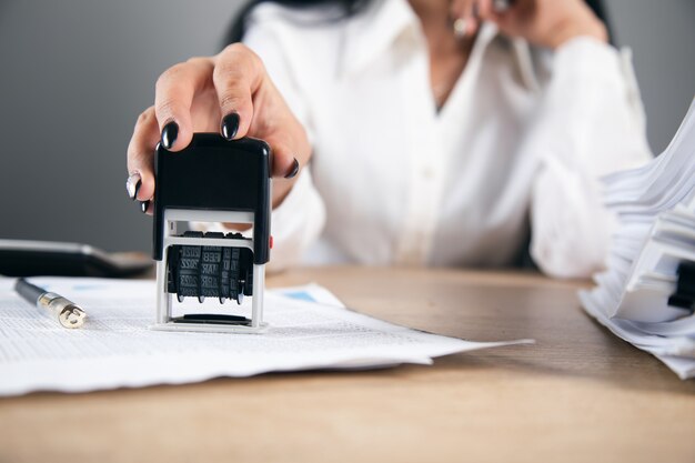 Record Or Permit Document Paper Stamper In Office