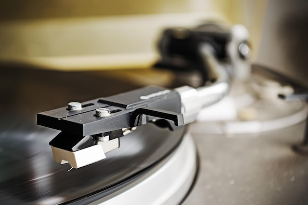 Record player stylus on a rotating disc