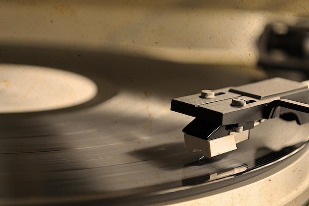 Record player stylus on a rotating disc