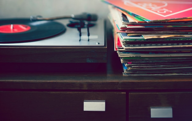 Record player and vintage vinyls on the table