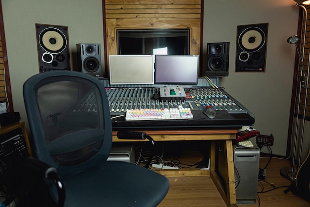 a recording studio with a sound board and sound equipment