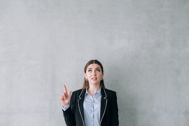 Recruiting. We are hiring. Business lady pointing at virtual sign.