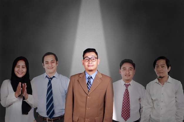 Recruitment in Business Concept Young Asian Businessman hilghlighted among other people