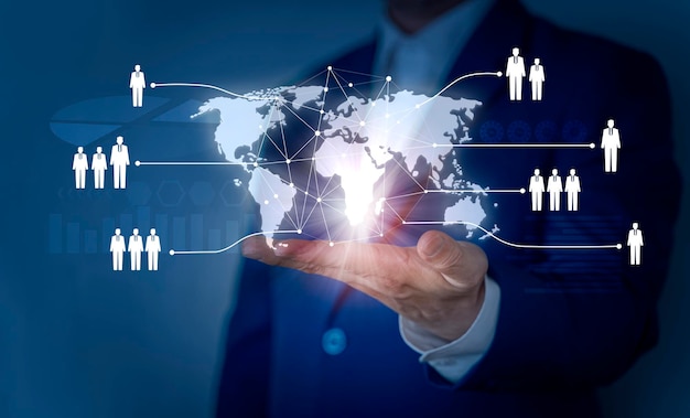 recruitment and employment concept with businessman hand selects a hologram of an employee on a blue background