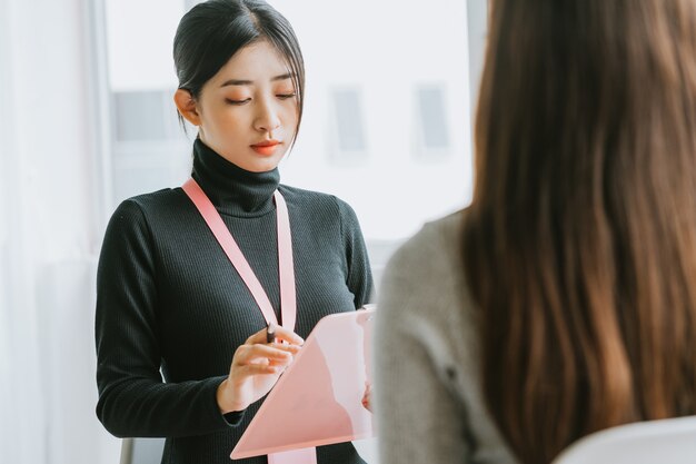 The recruitment officer is interviewing the candidate