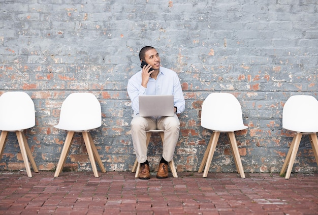 Recruitment phone call and person at an outside waiting room thinking of career opportunity and job search Interview sitting in line and man technology talk for we are hiring faq and networking