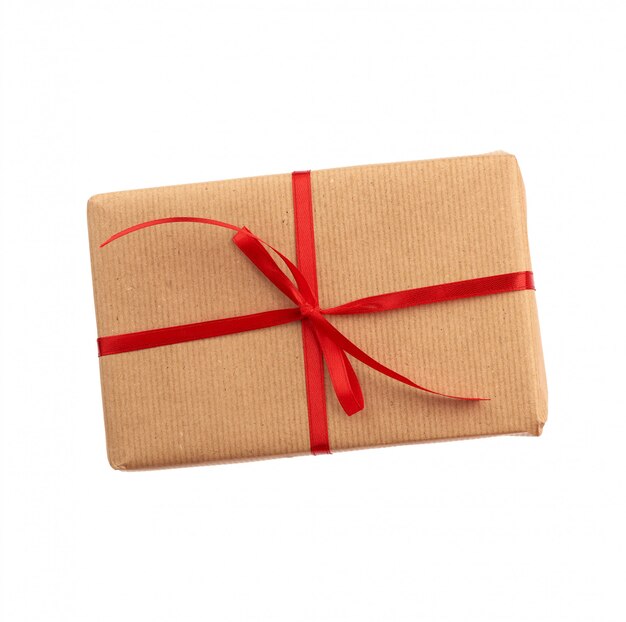 Прямоугольная коробка, завернутая в коричневую бумагу и перевязанная красным бантом