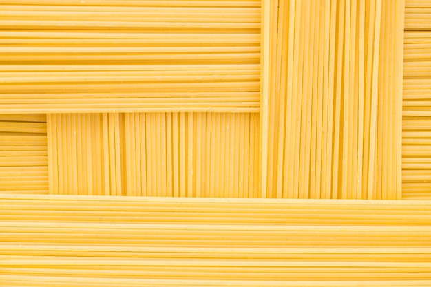 Rectangular geometric pattern of pasta bavette Background image of pasta from durum wheat