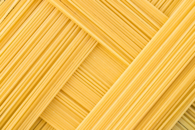 Rectangular geometric pattern of pasta bavette Background image of pasta from durum wheat