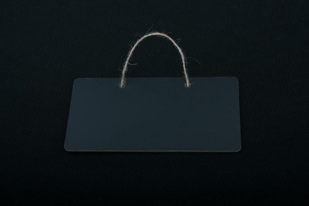 Rectangular shaped black notice board on black background