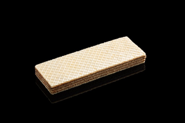 Rectangular wafer bar with chocolate isolated on black background