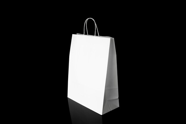 Recyclable craft paper bag for purchases gifts and takeaway food mock up on black background Environmentally friendly than singleuse plastic bags