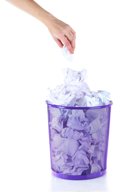 Recycle bin filled with crumpled papers isolated on white