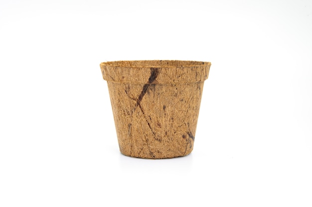 Recycle flower pot made of wood fiber isolated on white background