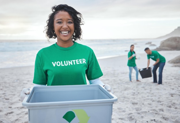 Recycle smile and portrait of woman at beach for plastic environment or earth day cleaning Recycling sustainability and climate change with volunteer and trash for pollution and eco friendly