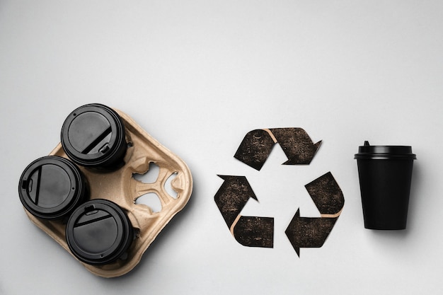 Recycle takeout coffee cups and trays ecological concept, top view