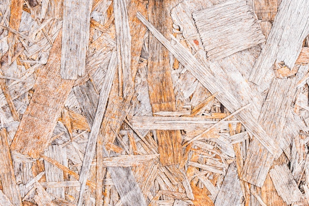 Recycled compressed wood chippings board background.