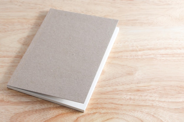 Recycled paper book on wooden background