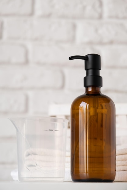 Recycled plastic pump bottle for mockup Minimalism brand packaging mockup design on white brick wall
