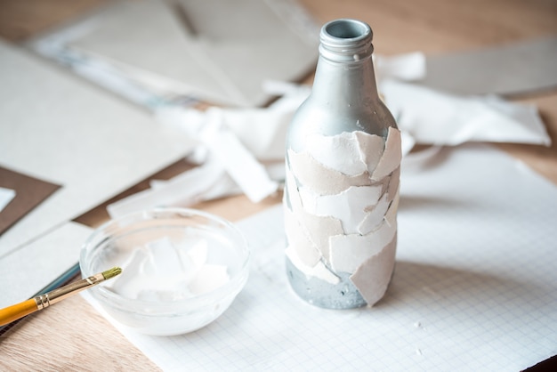 Recycling of garbage. handmade paper, gray bottle