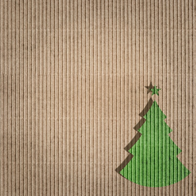 Photo recycling paper with green christmas tree. environment friendly card concept. paper texture.