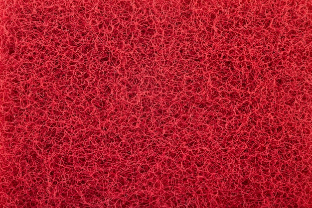 Red abrasive sponge texture background