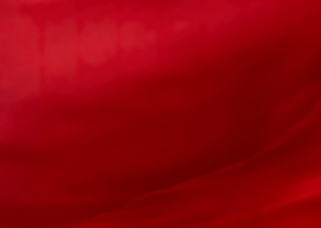 Red abstract art background silk texture and wave lines in motion for classic luxury design