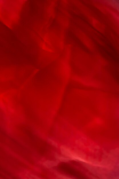 Photo red abstract art background silk texture and wave lines in motion for classic luxury design