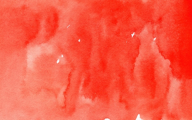 Red abstract watercolor background on textured paper