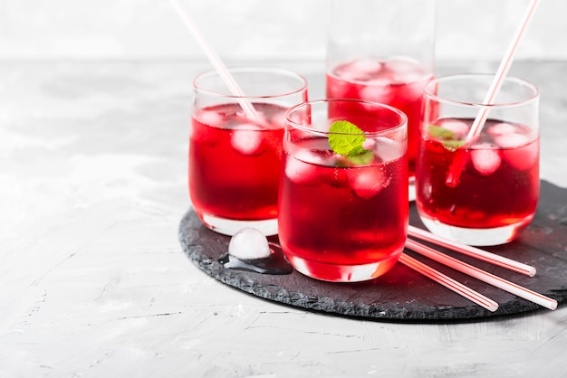 Red alcoholic coctail with ice and mint