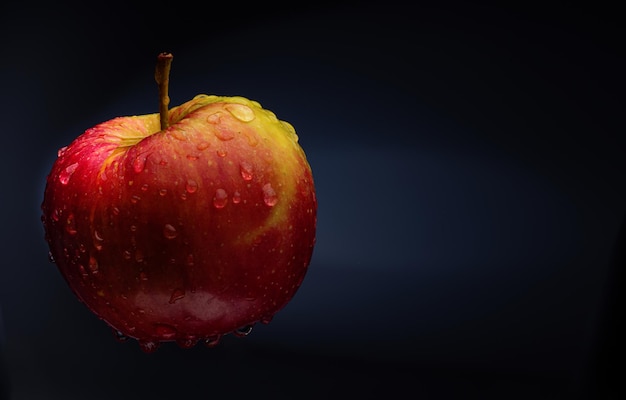 Red apple on a neutral black background.