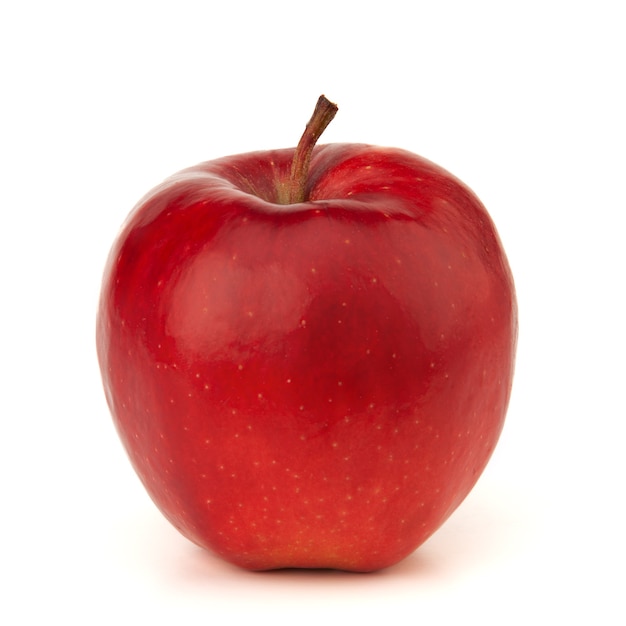 Фото Красное яблоко на белой поверхности с тенью.