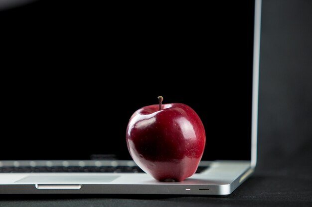 Red apple on table