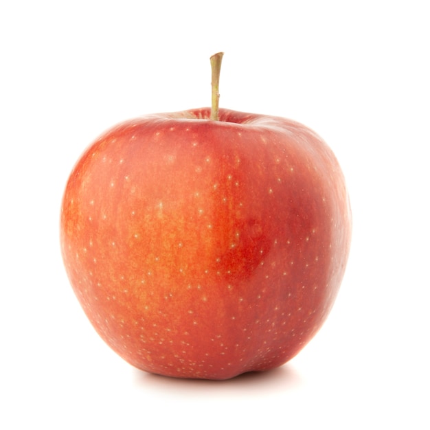 Red apple on a white surface with a shadow.