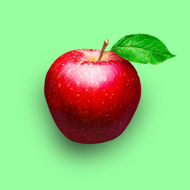 A red apple with a green leaf on it