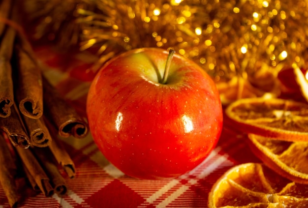 Red apple with orange slices cinnamon and gold garland