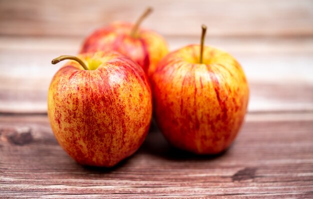 Red apple on a wooden background