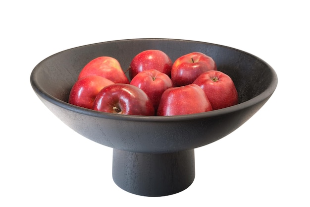 Red apples in black bowl isolated on white