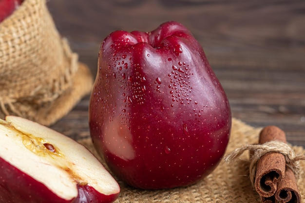 Red apples on a dark, wooden background. Selective focus. Harvesting. Healthy food.