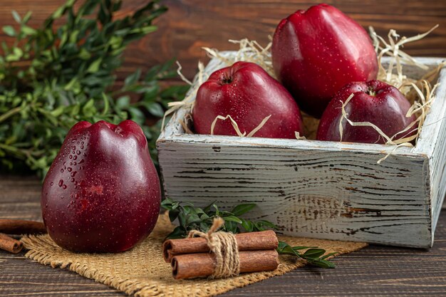 Red apples on a dark, wooden background. Selective focus. Harvesting. Healthy food.