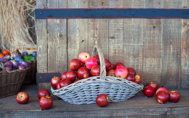 Red apples inside a wicker basket