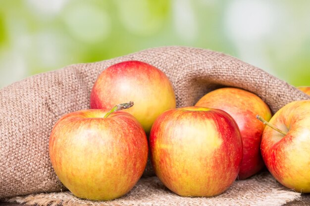 Red apples on an old wooden surface