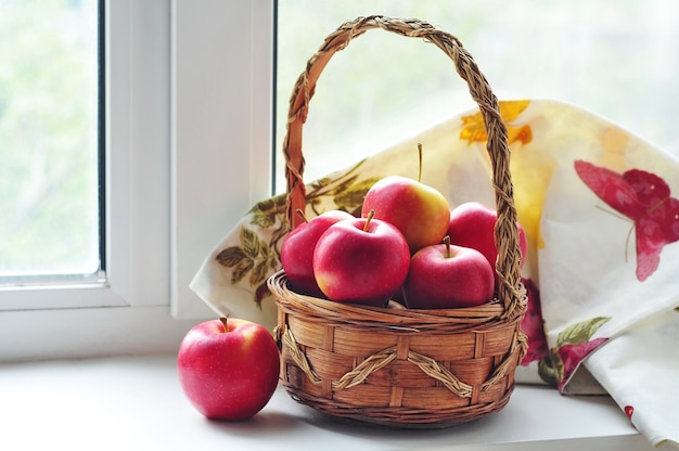 Red apples in wicker basket