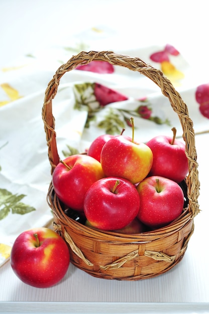 Red apples in wicker basket