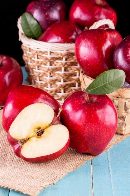 Red apples with leaves on the table. Top view