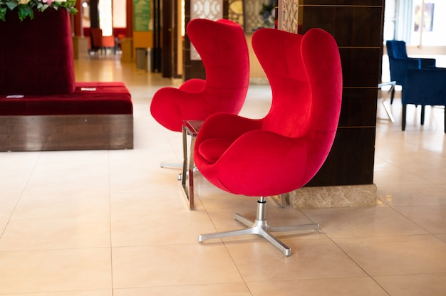 Red armchairs in the living room.